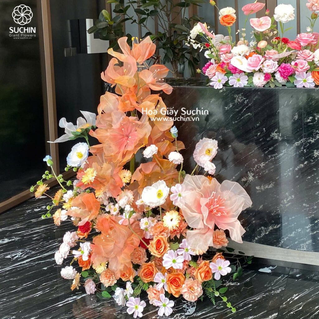 So sánh hoa tươi và hoa khổng lồ